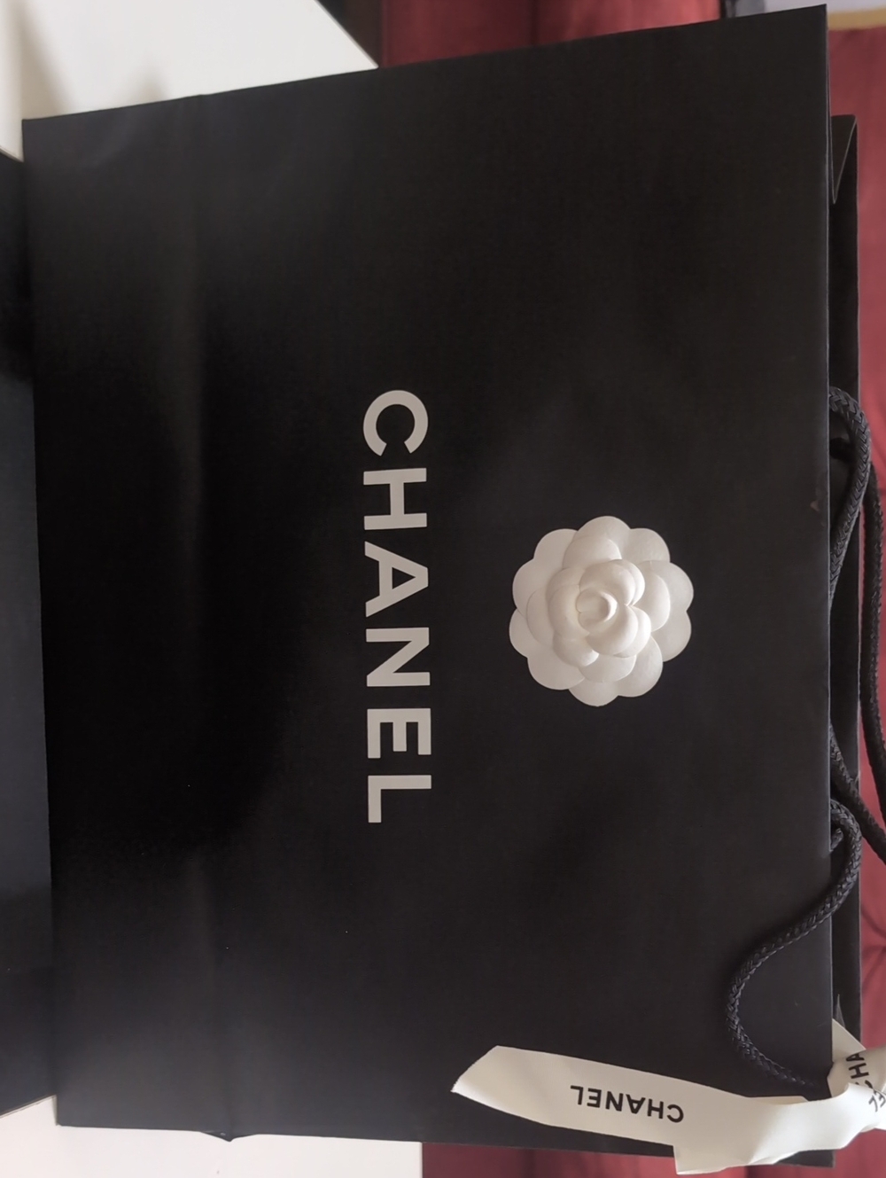 CHANEL Black Shopper Bag with White Camellia Accent